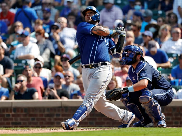 Aug 20, 2021; Chicago, Illinois, USA; Kansas City Royals catcher Salvador Perez (13) hits a solo home run against the Chicago Cubs during the sixth inning at Wrigley Field.